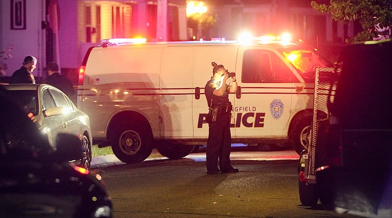 Springfield police collect evidence on Rosewood Avenue after report of a man shot in the street Saturday, July 8, 2023. Gregory Allen Wells died in the incident, the Clark County Coroner's Office confirmed Monday. MARSHALL GORBY \STAFF