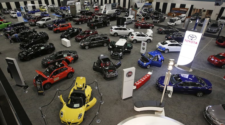 The 2016 Dayton Auto Show at the Dayton Convention Center includes cars from Alpha-Romeo to Volkswagen and has filled the hall. TY GREENLEES / STAFF
