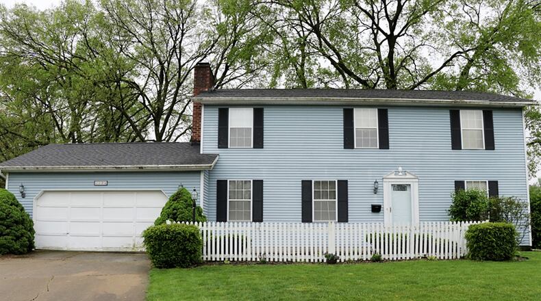 The vinyl-sided 2-story has about 4,160 sq. ft. of living space with 4 bedrooms and a full, unfinished basement. The house sits on a half-acre lot with mature trees and a creek. CONTRIBUTED PHOTO BY KATHY TYLER