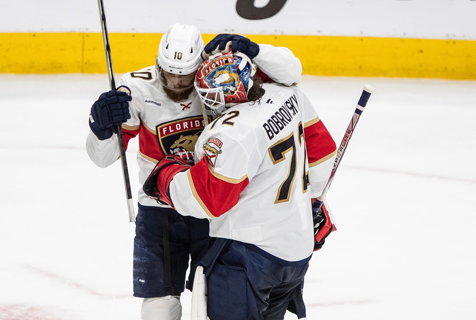 Florida Panthers' A.J. Greer (10) and Sergei Bobrovsky (72) celebrate after their win over the Edmonton Oilers in Game 5 of the NHL hockey Stanley Cup Final in Edmonton, Alberta, Saturday, June 14, 2025. ( Jason Franson/The Canadian Press via AP)