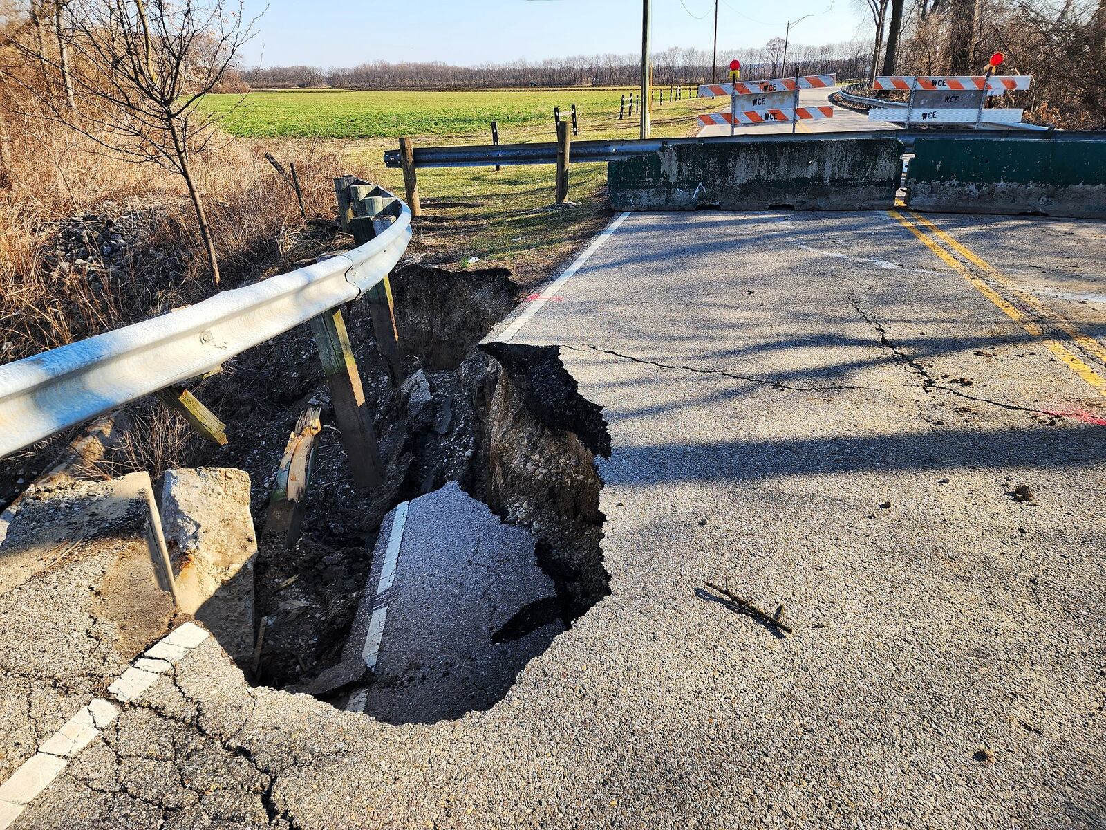 Franklin Trenton Road is closed after a section of bridged crumbled into creek bed below between Hobart Ave. and Water Source Dr. in Franklin Township. NICK GRAHAM/STAFF