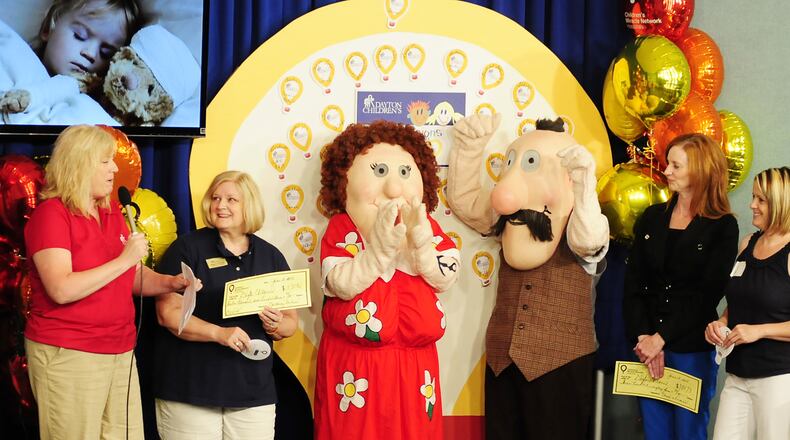 Peggy Kolonay with Max and Erma's present donations to co-host Nancy Wilson at the 31st Annual Children's Miracle Network Hospital Telethon with co-host WHIO-7 Cheryl McHenry, Mike Hartsock and Nancy Wilson on Sunday June 2, 2013.