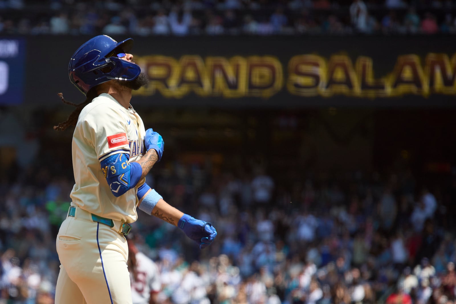 Seattle Mariners' J.P. Crawford rounds the bases on his grand slam off Cleveland Guardians starting pitcher Luis L. Ortiz during the second inning of a baseball game Sunday, June 15, 2025, in Seattle. (AP Photo/John Froschauer)