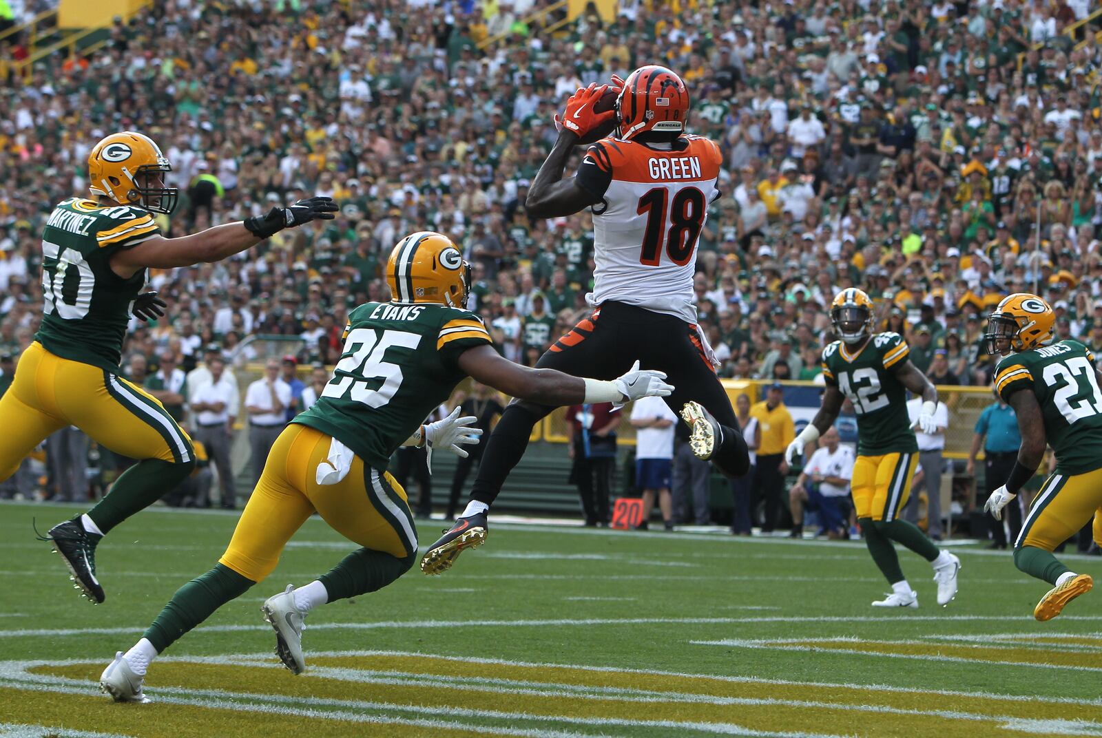 GREEN BAY, WI - SEPTEMBER 24: A.J. Green #18 of the Cincinnati Bengals catches a touchdown pass during the first quarter against the Green Bay Packers at Lambeau Field on September 24, 2017 in Green Bay, Wisconsin. (Photo by Dylan Buell/Getty Images)