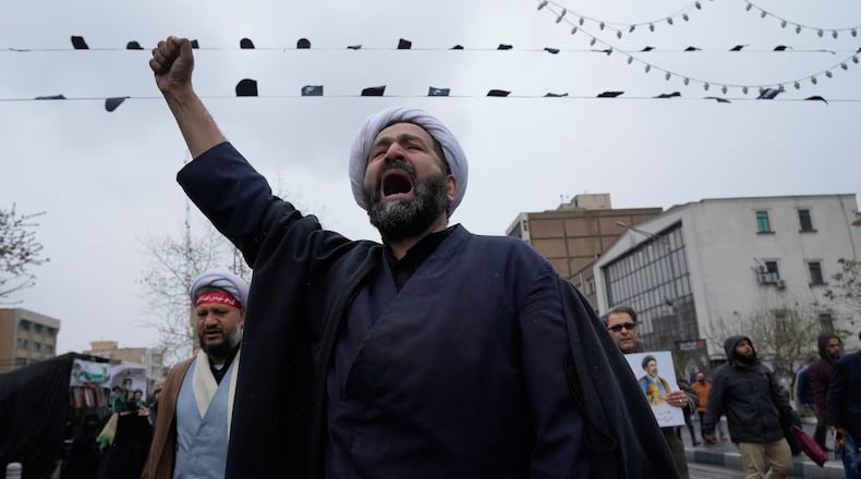 A cleric chants slogans during the annual anti-Israeli Quds Day, or Jerusalem Day rally in support of Palestinians in Tehran, Iran, Friday, March 13, 2026. (AP Photo/Vahid Salemi)