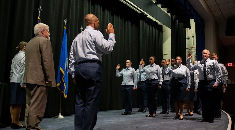 Col. Marqus Randall, then the National Space Intelligence Center commander, administers the oath of office to former Army officers during an interservice transfer ceremony Dec. 16, 2022, at the National Museum of the U.S. Air Force, Wright-Patterson Air Force Base. In the ceremony, 11 former soldiers and 125 former Air Force civilian employees were sworn into the Space Force. (U.S. Air Force photo by R.J. Oriez)