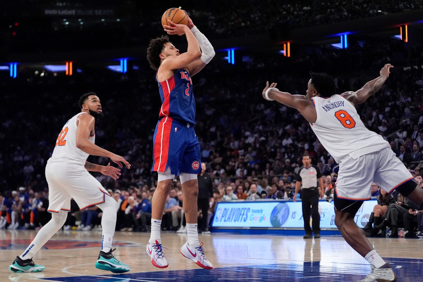 Detroit Pistons guard Cade Cunningham (2) shoots past New York Knicks forward OG Anunoby (8) during the first half of Game 1 in an NBA basketball first-round playoff series, Saturday, April 19, 2025, in New York. (AP Photo/Julia Demaree Nikhinson)