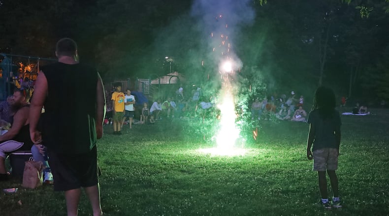 Hundreds of people gathered in Veteran's Park in Springfield on July 3 for the Buck Creek Boom fireworks show to start. BILL LACKEY/STAFF