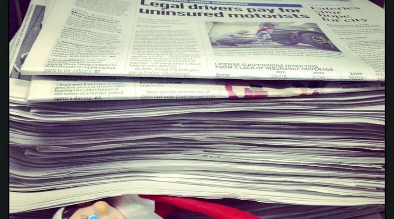 The elf on the shelf is checking up on the Dayton Daily News.