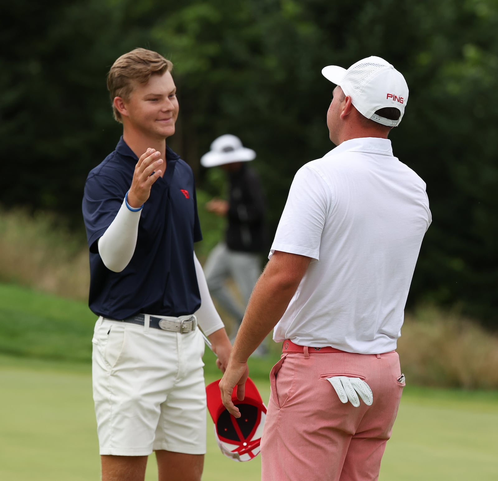 T.J. Kreusch (left) congratulates Joe Wilson IV on his one-shot victory Friday in the Ohio Amateur at Zanesville Country Club. Ron Alvey/CONTRIBUTED