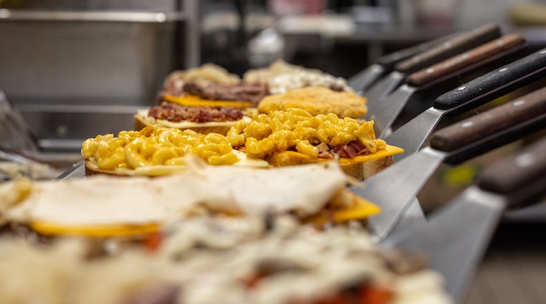 All Cincinnati-area Tom & Chee locations will offer a free handcrafted melt to all veterans and active-duty military on Friday. CONTRIBUTED