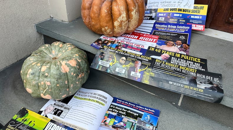 A Halloween display of unwanted campaign fliers sits in front of a private home in The Heights neighborhood of Jersey City, N.J, Thursday, Oct. 23, 2025. (AP Photo/Robert Yoon)