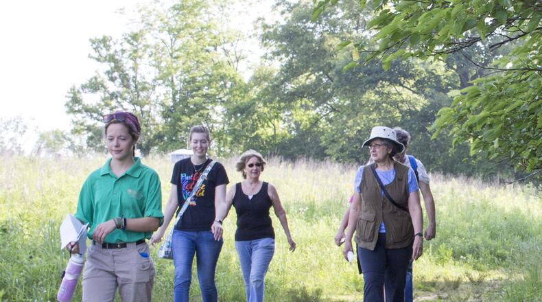The Winters-Bellbrook Community Library’s Walk and Talk Book Club discussed Bill Bryson s “A Walk in the Woods” while hiking through Sweet Arrow Reserve on June 17. CONTRIBUTED
