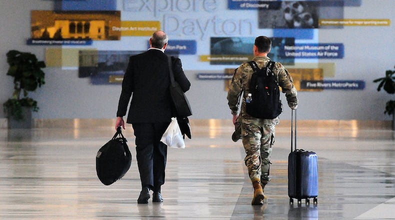 Travelers walk through Dayton International Airport Thursday, June 27, 2024. MARSHALL GORBY/STAFF