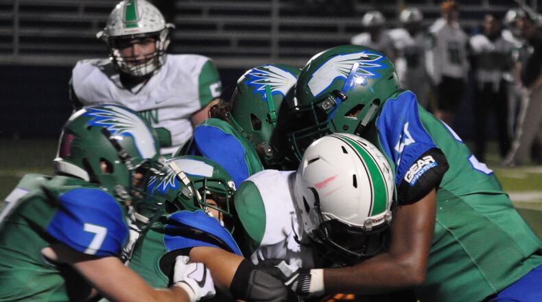 Badin’s Lavassa Martin finds himself surrounded by Chaminade Julienne defenders earlier this season at Roger Glass Stadium in Dayton. NICK DUDUKOVICH/FILE PHOTO