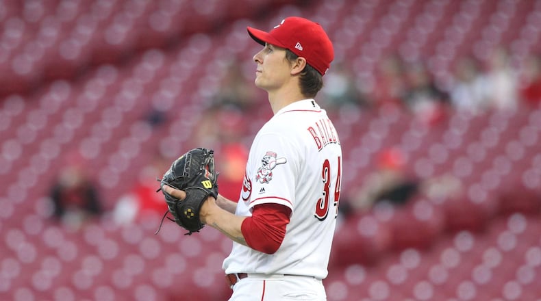 Reds starter Homer Bailey reacts after giving up a home run against the Brewers on Tuesday, May 1, 2018, at Great American Ball Park in Cincinnati. David Jablonski/Staff