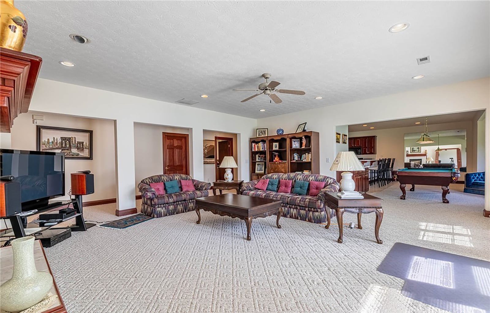 The finished walk out basement has a recreation room with fireplace, a game room and full kitchen as well as a home office, full bathroom and extra storage space. CONTRIBUTED
