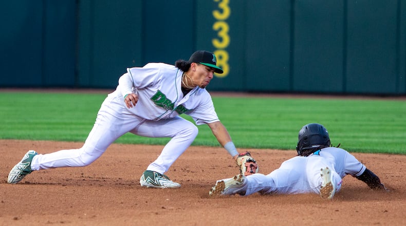 Dayton shortstop Edwin Arroyo tags out Beloit's Osiris Johnson, who tried to steal second base, on a throw from catcher Cade Hunter during Tuesday night's game at Day Air Ballpark. Jeff Gilbert/CONTRIBUTED