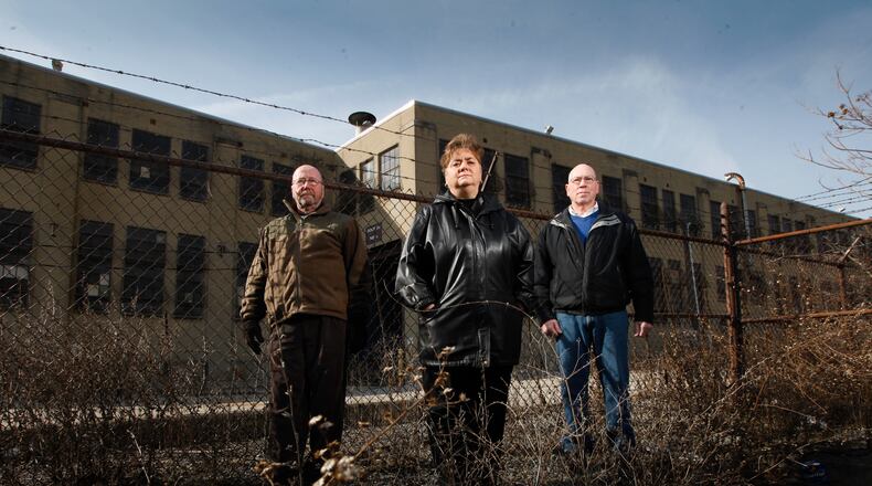 Delphi salaried retirees Tom Green, left, Marlane Bengry and Tom Rose, in a 2013 file photo
