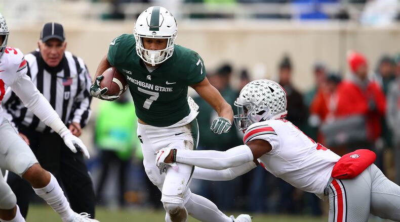 EAST LANSING, MI - NOVEMBER 10: Cody White #7 of the Michigan State Spartans tries to get around the tackle of Jeffrey Okudah #1 of the Ohio State Buckeyes after a first half catch at Spartan Stadium on November 10, 2018 in East Lansing, Michigan. (Photo by Gregory Shamus/Getty Images)