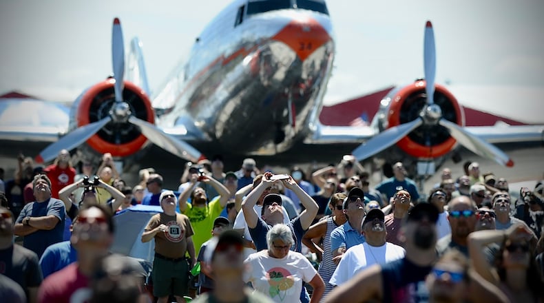 Spectators look to the skies at the Dayton Air Show. PHOTO BY MARSHALL GORBY