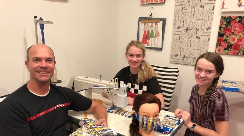 Allie Lunt, middle, has spent more than 20 hours sewing face masks for health care workers and first responders.