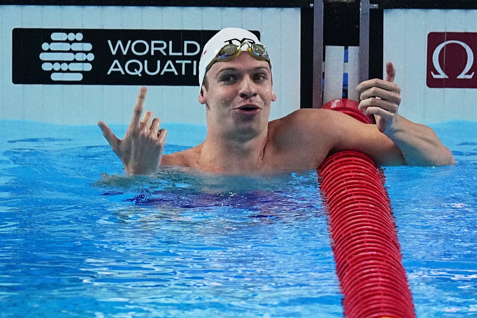 Leon Marchand of France reacts after competing in the men's 200-meter individual medley semifinals at the World Aquatics Championships in Singapore, Wednesday, July 30, 2025. (AP Photo/Ng Han Guan)