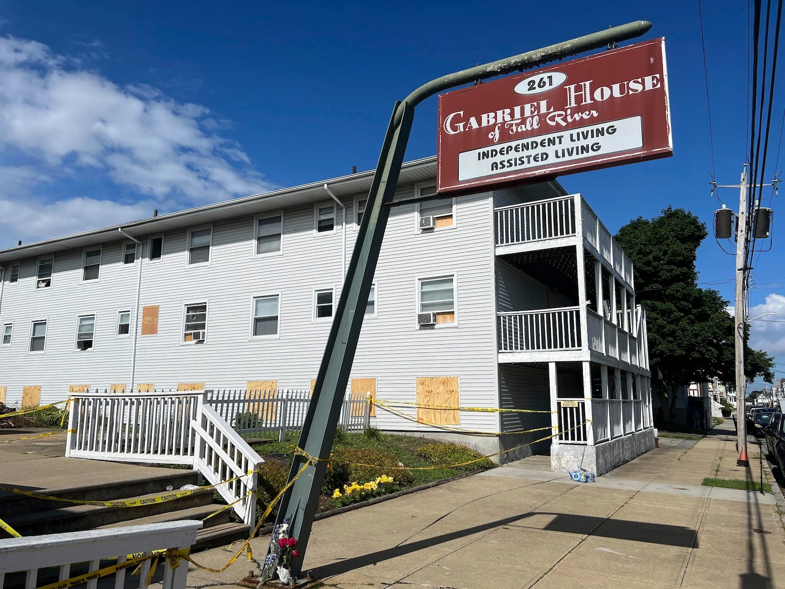 FILE - Boards cover the windows of the Gabriel House assisted living facility, July 15, 2025 in Fall River, Mass. (AP Photo/Kimberlee Kruesi, file)