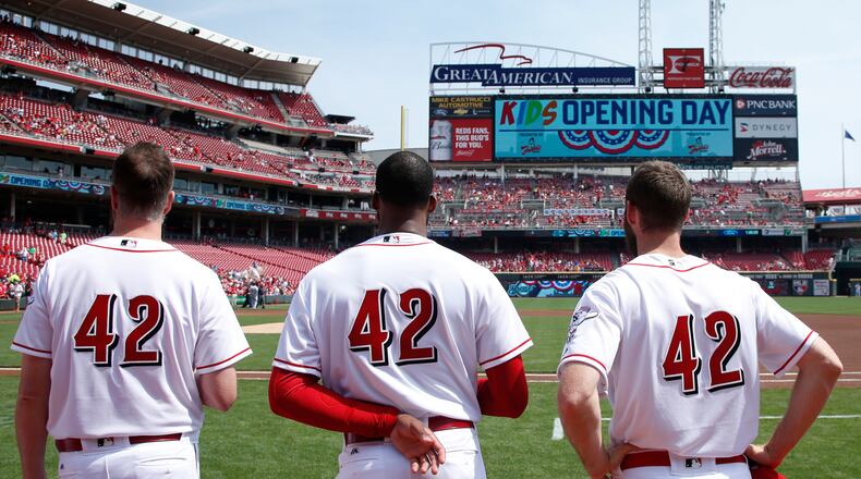 CINCINNATI, OH - APRIL 15: Cincinnati Reds players wear No. 42 in honor of Jackie Robinson Day as they stand for the national anthem prior to a game against the Milwaukee Brewers at Great American Ball Park on April 15, 2017 in Cincinnati, Ohio. (Photo by Joe Robbins/Getty Images) *** BESTPIX ***