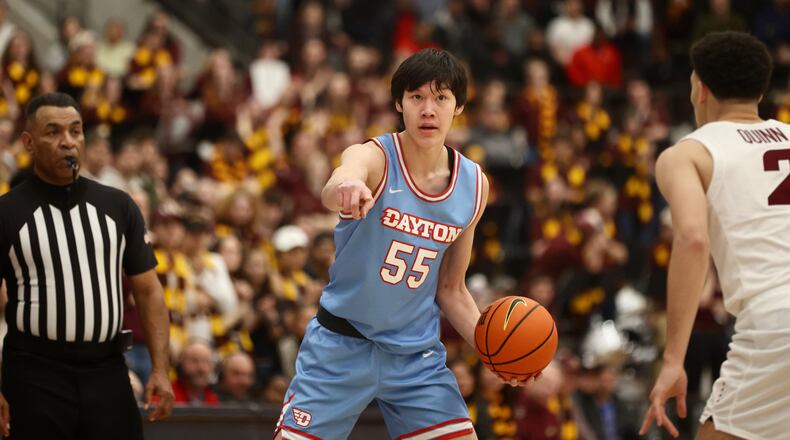 Dayton's Mike Sharavjamts runs the offense against Loyola Chicago on Friday, Feb. 17, 2023, at Gentile Arena in Chicago, Ill. David Jablonski/Staff
