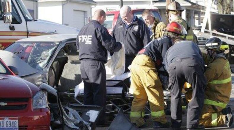 Dayton fire crews respond to a car crash. STAFF