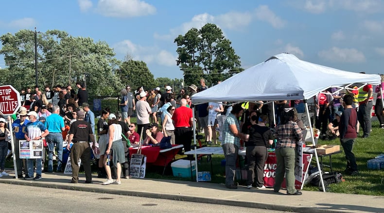 About 100 protestors attended a rally Sunday night outside the Butler County Jail in Hamilton. They want a 19-year-old Western Hills High School graduate released from jail after he was arrested by ICE officials. RICK McCRABB/CONTRIBUTOR