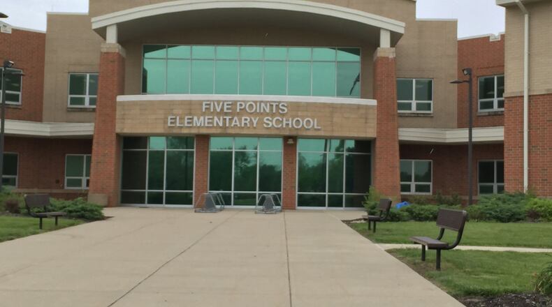A section of Lytle- Five Points Road in front of Five Points Elementary School has now been repaired following a two-day closure. FILE PHOTO
