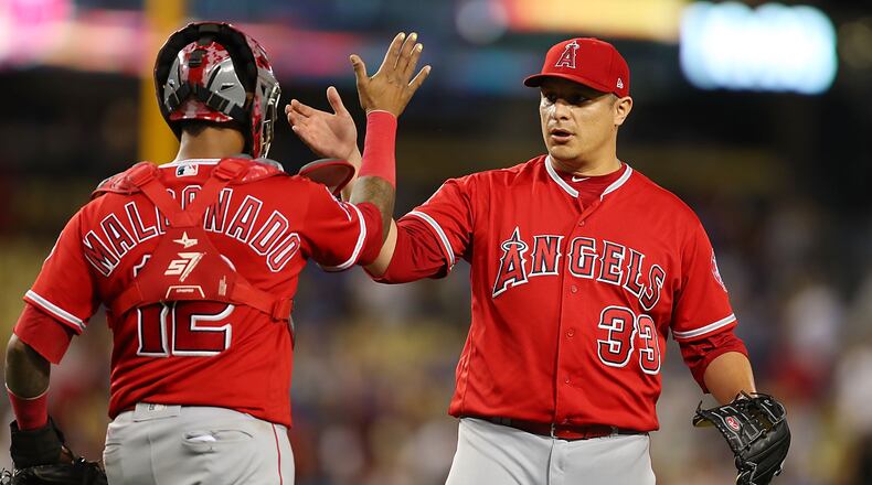 LOS ANGELES, CA - JUNE 26: Martin Maldonado #12 of the Los Angeles Angels and David Hernandez #33 of the Los Angeles Angels celebrate their 4-0 win against the Los Angeles Dodgers at Dodger Stadium on June 26, 2017 in Los Angeles, California. (Photo by Joe Scarnici/Getty Images)