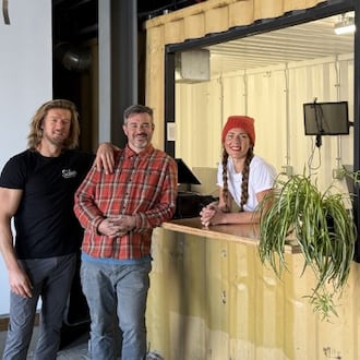 Wes Hartshorn, left and Shannon Thomas, owners of The Silos Food Hall & Bar are seen with Whitney Kling, local chef and owner of Fête, a new food vendor inside the hall in Dayton. CONTRIBUTED