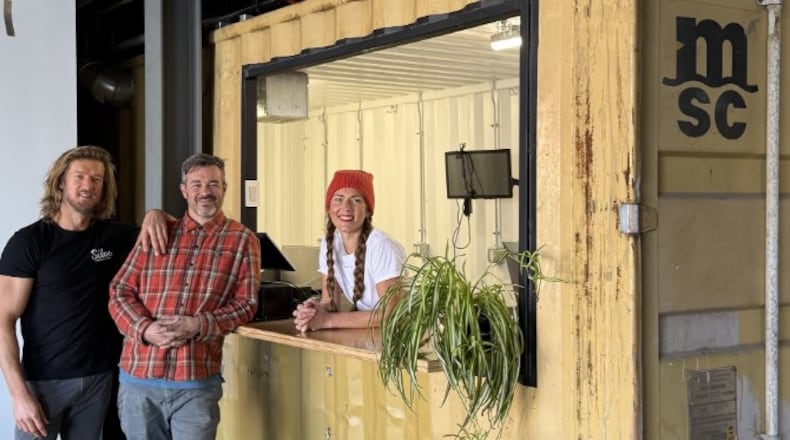 Wes Hartshorn, left and Shannon Thomas, owners of The Silos Food Hall & Bar are seen with Whitney Kling, local chef and owner of Fête, a new food vendor inside the hall in Dayton. CONTRIBUTED