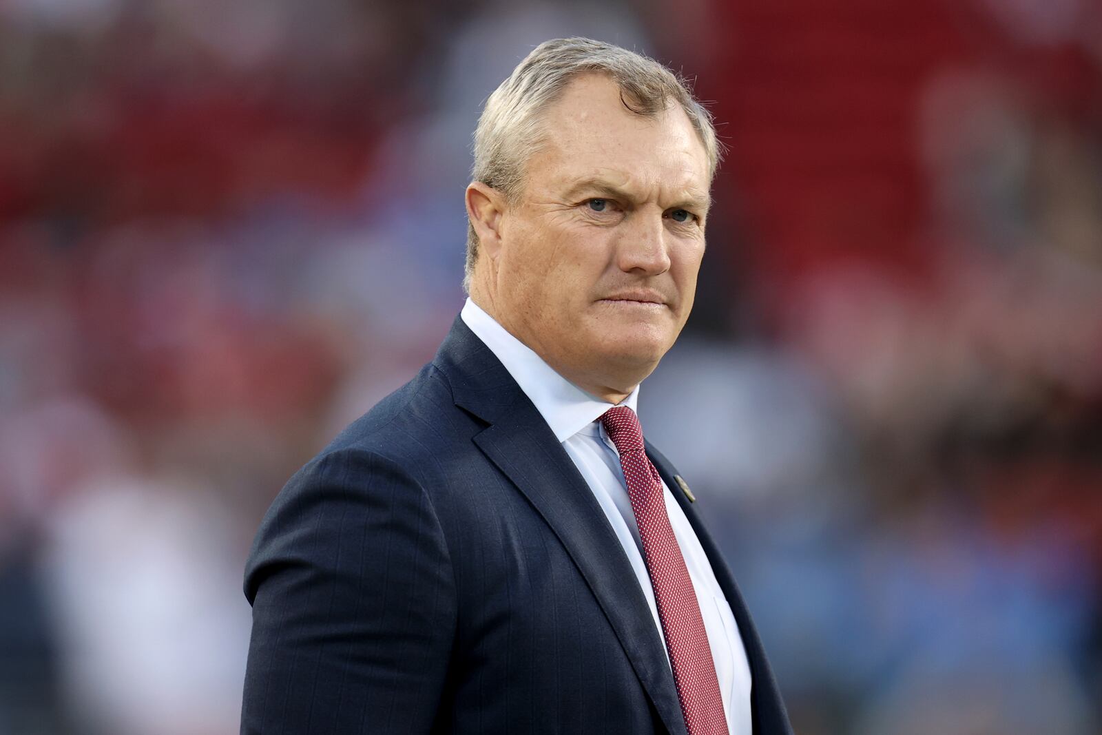 FILE - San Francisco 49ers general manager John Lynch walks onto the field during an NFL football game against the Detroit Lions, Monday, Dec 30, 2024, in Santa Clara, Calif. (AP Photo/Scot Tucker, file)