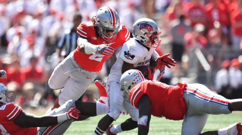 COLUMBUS, OH - SEPTEMBER 23:  Chase Young #2 of the Ohio State Buckeyes dives to make a tackle on Lexington Thomas of the UNLV Rebels in the second quarter at Ohio Stadium on September 23, 2017 in Columbus, Ohio.  (Photo by Jamie Sabau/Getty Images)