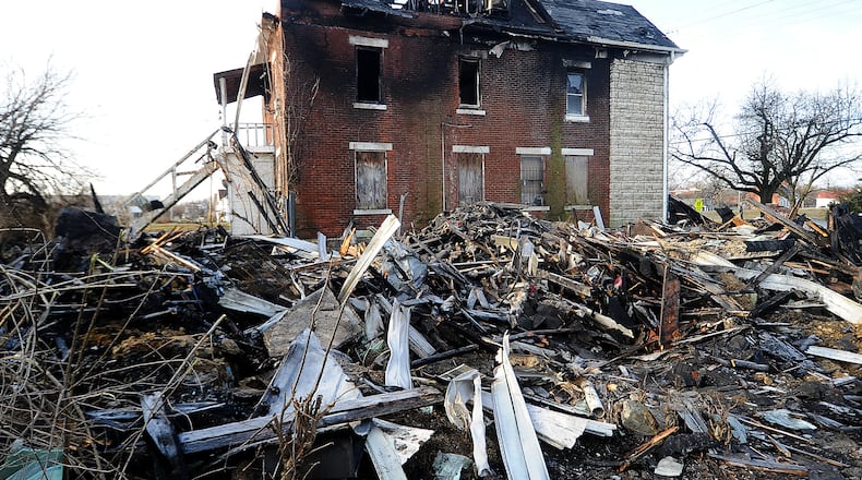 Demolition continues Thursday, March 9, 2023 after massive North Broadway Street fire Wednesday morning. Five people were found dead in the debris Wednesday. MARSHALL GORBY\STAFF