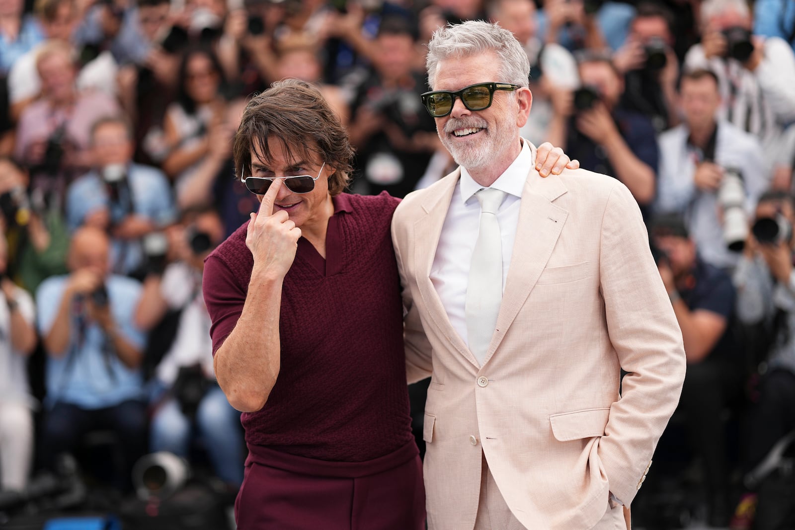 Tom Cruise, left, and director Christopher McQuarrie pose for photographers during the photo call for the film 'Mission: Impossible – The Final Reckoning' at the 78th international film festival, Cannes, southern France, Wednesday, May 14, 2025. (Photo by Scott A Garfitt/Invision/AP)