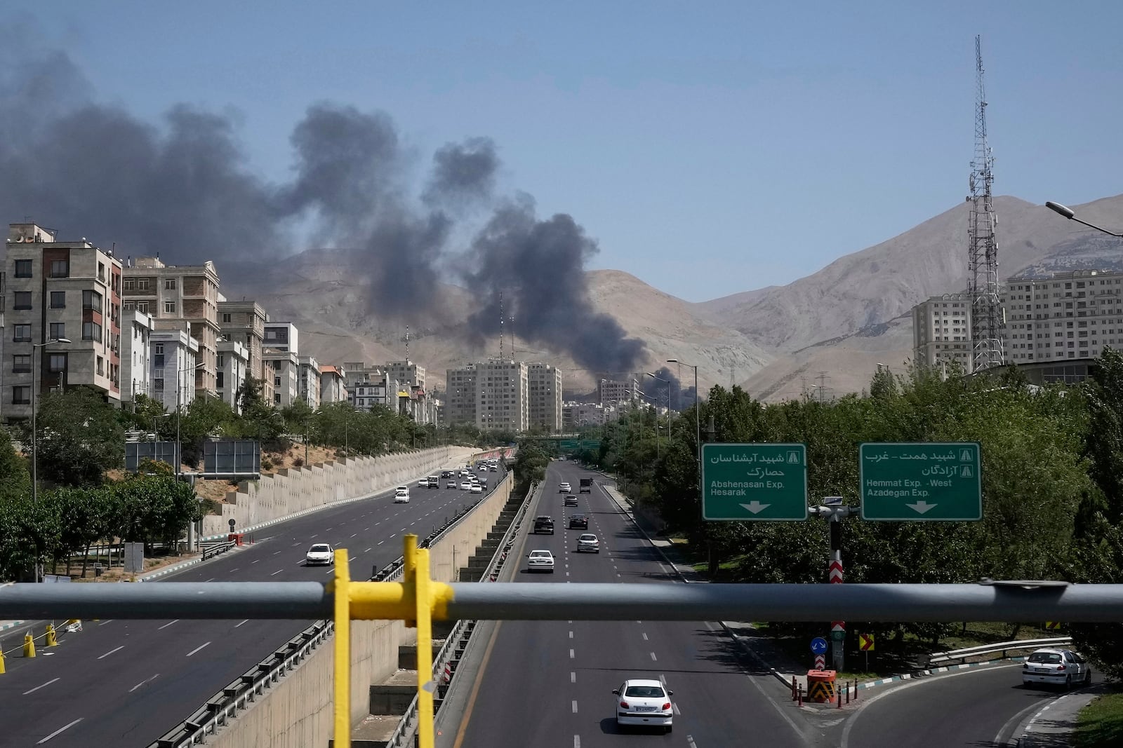 Smoke rises from an oil storage facility after it appeared to have been struck by an Israeli strike on Saturday, in Tehran, Iran, Monday, June 16, 2025. (AP Photo/Vahid Salemi)