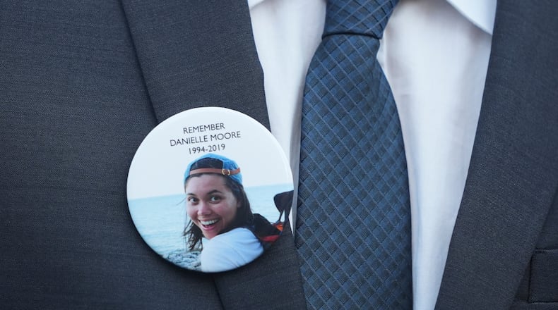 FILE - A family member wears a photo of Boeing crash victim Danielle Moore before a hearing at federal court in Fort Worth, Texas, Sept. 3, 2025. (AP Photo/LM Otero, File)