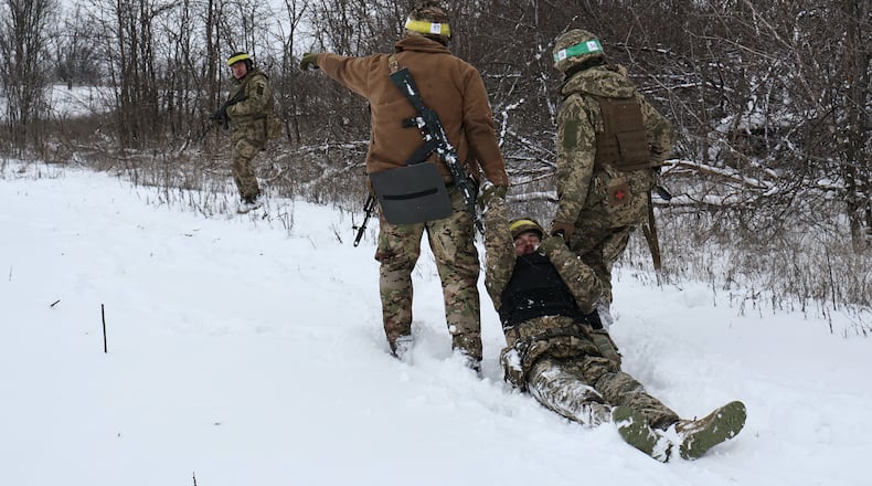 In this photo provided by Ukraine's 65th Mechanized Brigade press service, recruits attend drills at a training ground in the Zaporizhzhia region, Ukraine, Monday, Dec. 29, 2025. (Andriy Andriyenko/Ukraine's 65th Mechanized Brigade via AP)