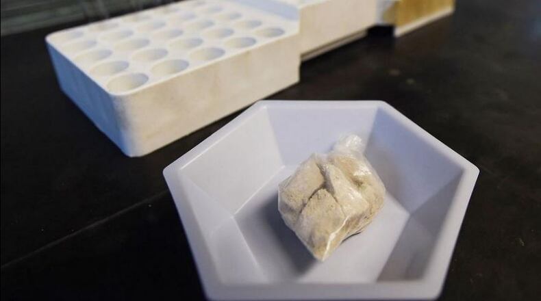 The drug “gray death” lies in a dish at the crime lab of the Georgia Bureau of Investigations in Decatur, Ga., on Thursday, May 4, 2017. The new and dangerous opioid combo underscores the ever-changing nature of the U.S. addictions epidemic. Investigators who nicknamed the mixture have detected it or recorded overdoses blamed on it in Alabama, Georgia and Ohio. (AP Photo/Mike Stewart)