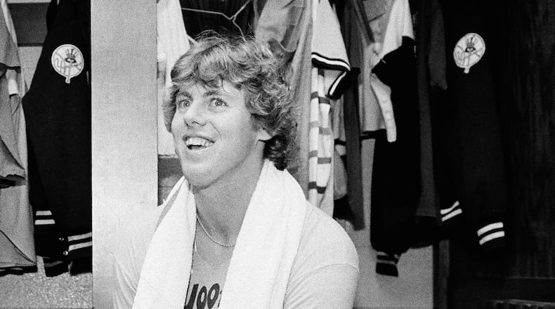 FILE - Yankee pitcher Ken Clay smiles in the dressing room after a Yankee victory over Kansas City in the American League championship opener, Oct. 3, 1978, Kansas City, Mo. (AP Photo/John Storey, file)