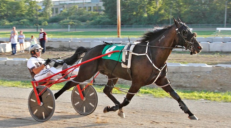 Tony Morgan taking Bold Decision across finish line to win the Eddie Morgan Sr./ Eddie Morgan Jr. Memorial at Miami County Fairgrounds on Monday night. Ben Holton/Conrad Photo