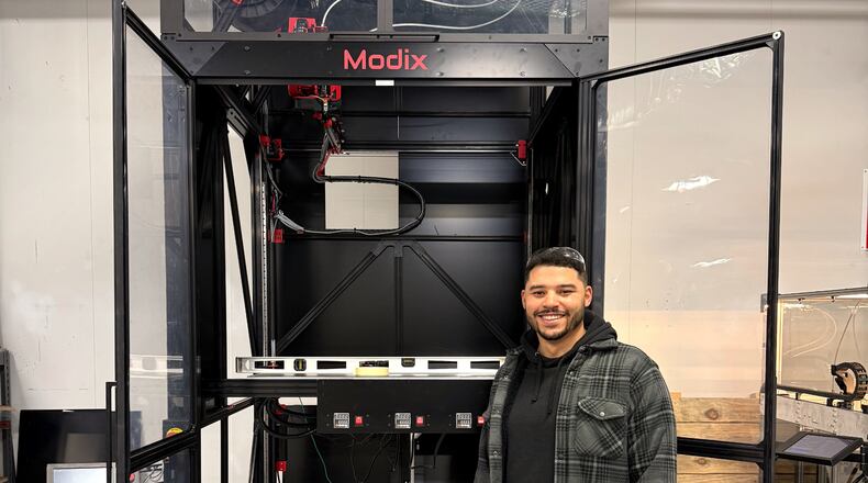 Cornerstone Research Group Deputy Project Leader Kevin Blount in front of the company’s newly assembled, large-format 3D printer, which will be used as a testbed for new designs, processes, and hardware. Cornerstone photo