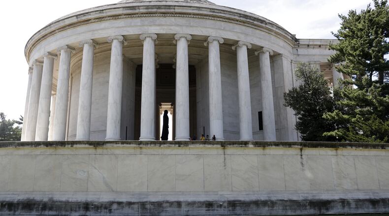 A grimy biofilm is seen along the upper edges corners, and outside wall of the the Thomas Jefferson Memorial in Washington, Wednesday, Aug. 10, 2016. In recent years, the white rotunda has become increasingly darkened by a colony of microscopic organisms called biofilm which adheres to stone surfaces. National Park Service officials are experimenting with several cleaning solutions in hopes of removing the biofilm without further damage to the soft marble or encouraging further growth. (AP Photo/Carolyn Kaster)