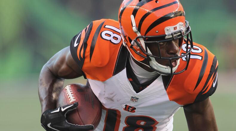 CINCINNATI, OH - AUGUST 12: A.J. Green #18 of the Cincinnati Bengals runs the football upfield during the game against Minnesota Vikings at Paul Brown Stadium on August 12, 2016 in Cincinnati, Ohio. (Photo by John Grieshop/Getty Images)
