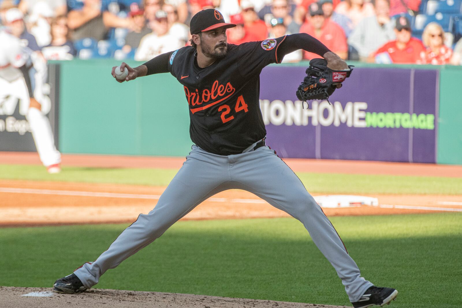 Baltimore Orioles starting pitcher Zach Eflin delivers against the Cleveland Guardians during the first inning of a baseball game, Wednesday, July 23, 2025, in Cleveland. (AP Photo/Phil Long)